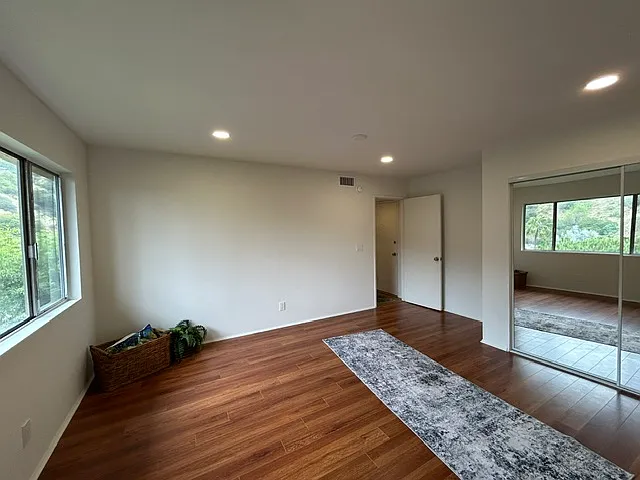 Main level bedroom down the private hallway. The other two bedrooms are downstairs.