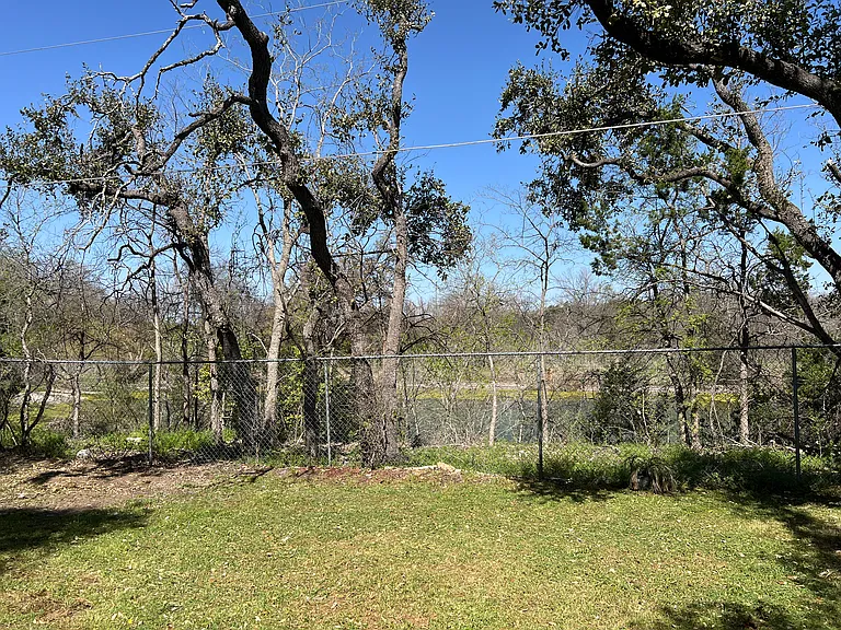 Large back yard that back to water pond