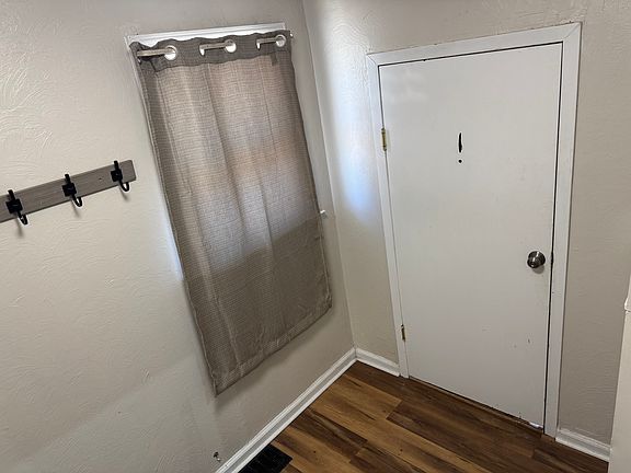 view of front door to your apartment from the vestibule