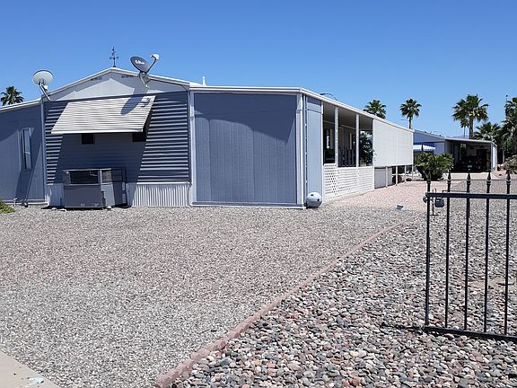 Back and side of home. Note storage