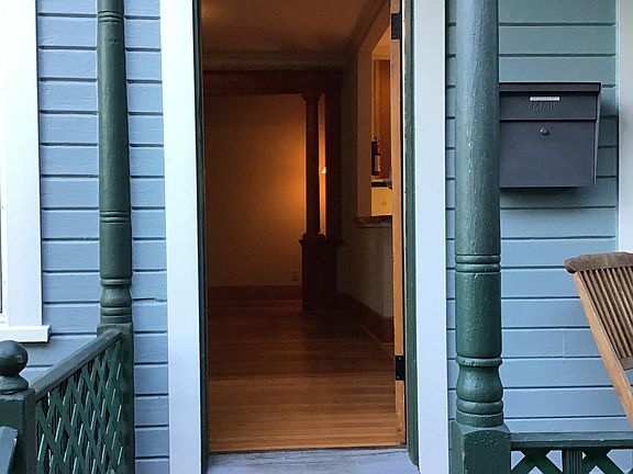 Welcome home! Secured front porch mailbox.