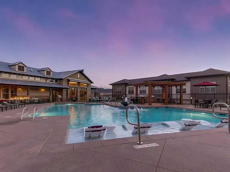 Swimming pool and sundeck with lounge seating