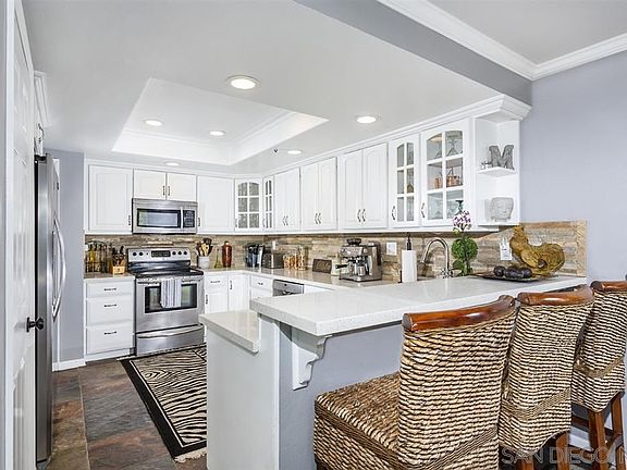 Stone Faced Fireplace. Large storage closed under stairway.