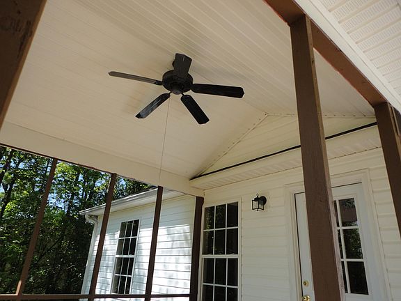 covered deck includes ceiling fan