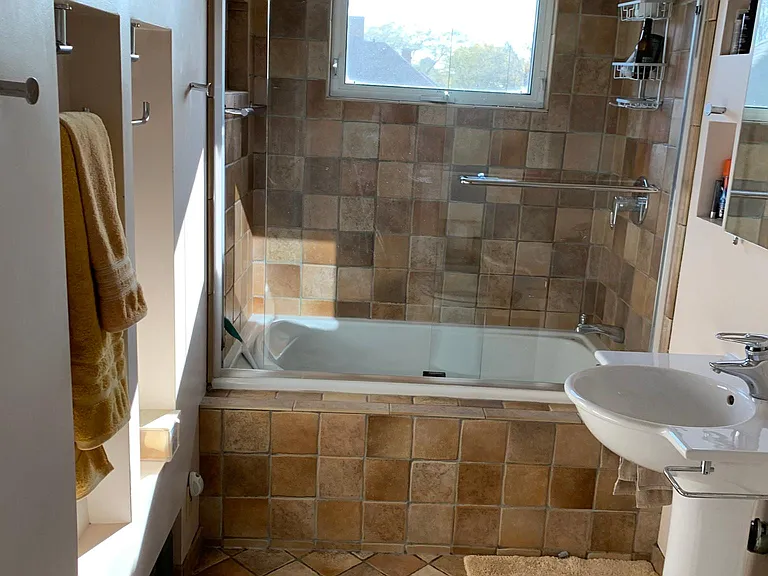 Upstairs bathroom with deep tub and sunrise views