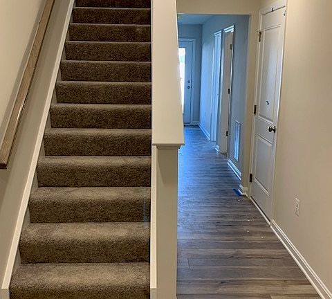 Staircase connecting basement and living floor. 

This level has a full bedroom, full bathroom, storage closet with a door and much more...