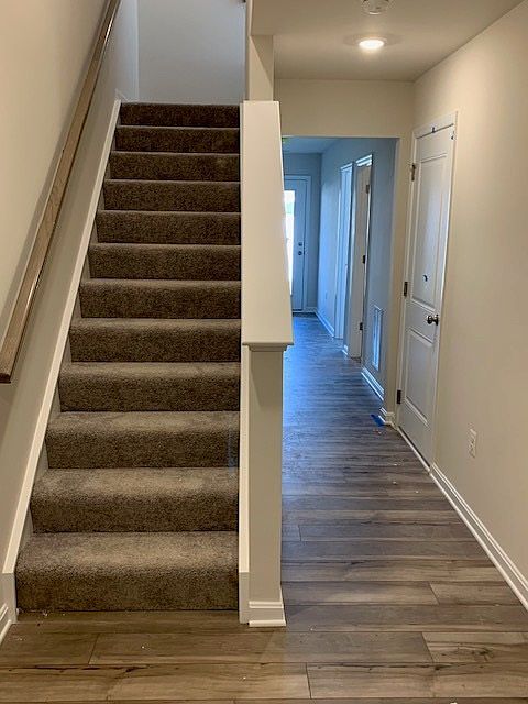 Staircase connecting basement and living floor. 

This level has a full bedroom, full bathroom, storage closet with a door and much more...