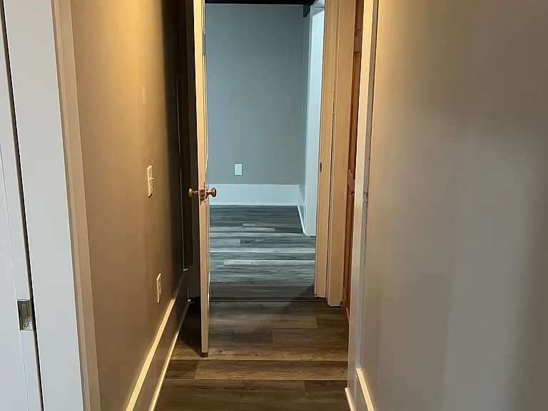 Basement hallway into room 2.