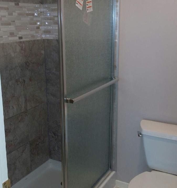 Primary Bedroom/Bathroom walk in tile shower