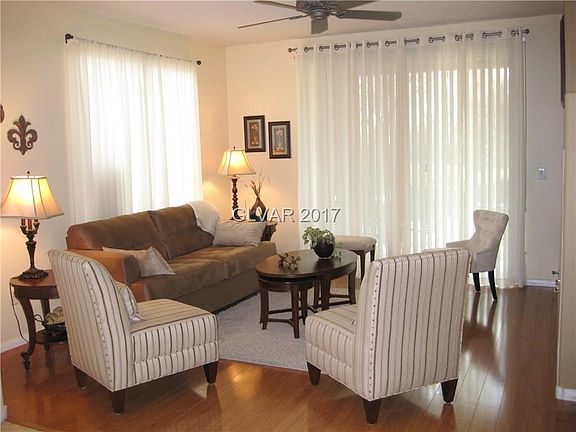 Bright open living room with engineered hardwood flooring.