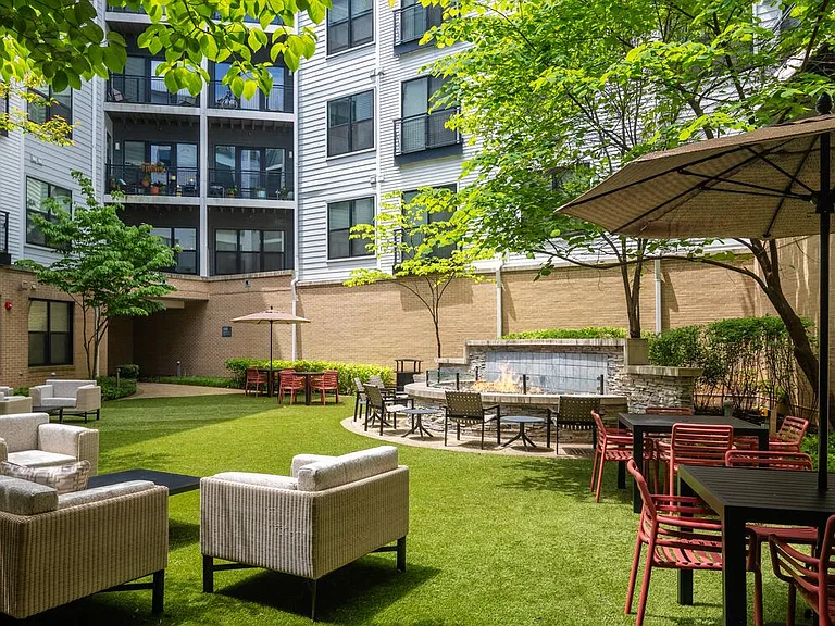 Courtyard with multiple seating areas and fire pit