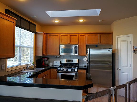 Kitchen with stainless steel finish appliances, plenty of st