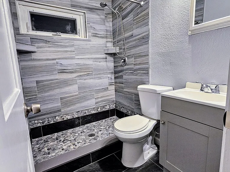 Apt B bathroom with large shower