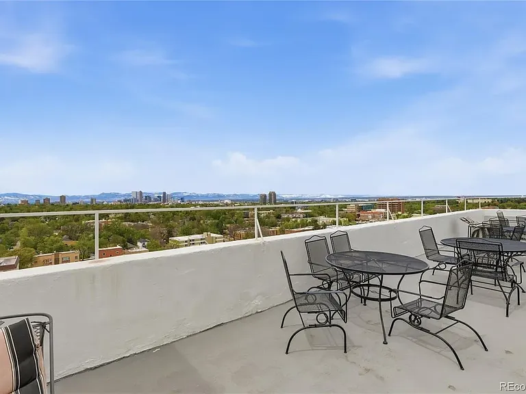 Rooftop deck with mountain and city views