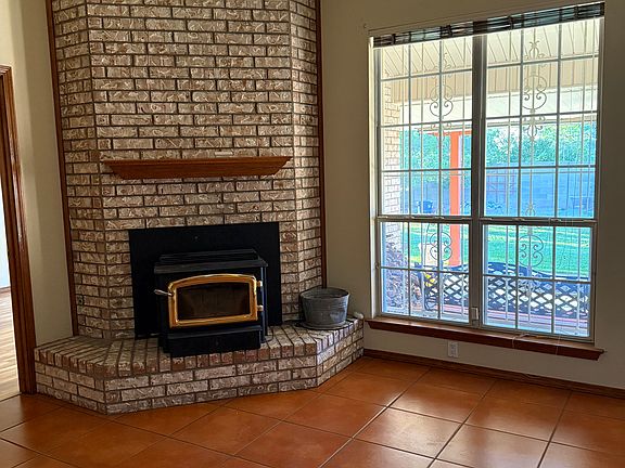 Family room with cozy wood burning fireplace.