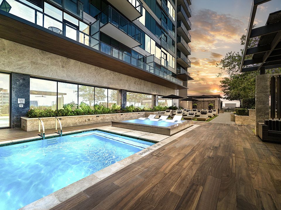 Resort-style pool deck with a variety of sun loungers