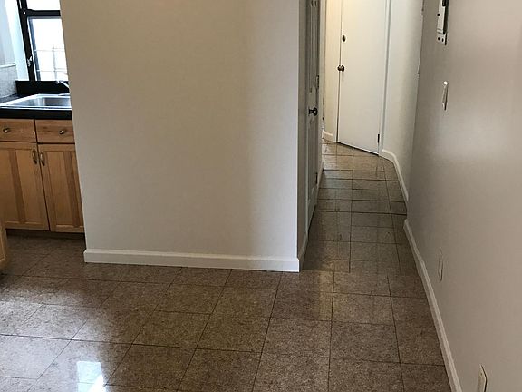 Kitchen and hall to front of the apartment.