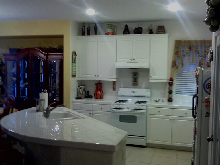 Kitchen and dining with previously gold dining and family paint and curtains