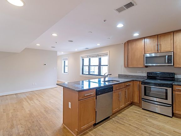 Kitchen looking into den with East facing windows.