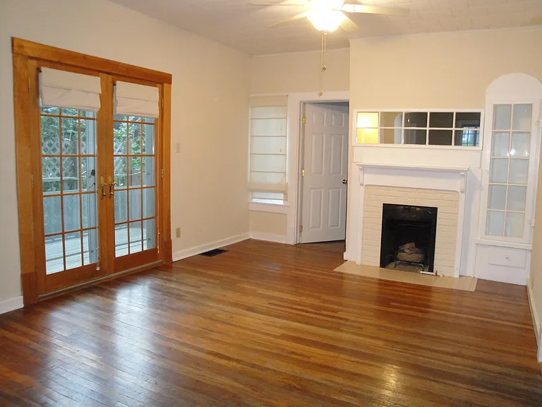 Dining Room with fireplace and French doors to deck