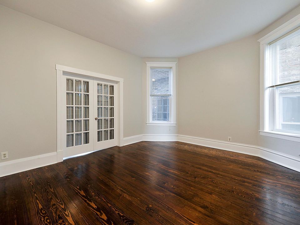 primary bedroom entrance via french doors off living room