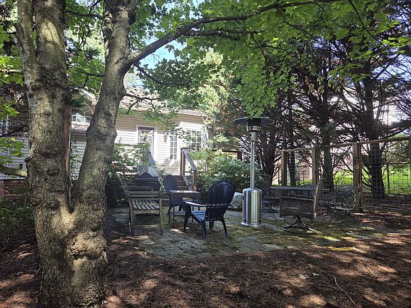 Shaded back deck and patio, backing up to a walking trail