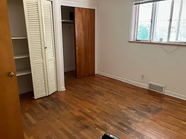 Room 2 - 3 closets, 2 with built in shelves