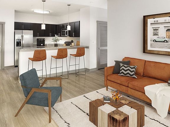 Renovated Package II Kitchen, living and dining area with hard surface flooring throughout and pendant lighting