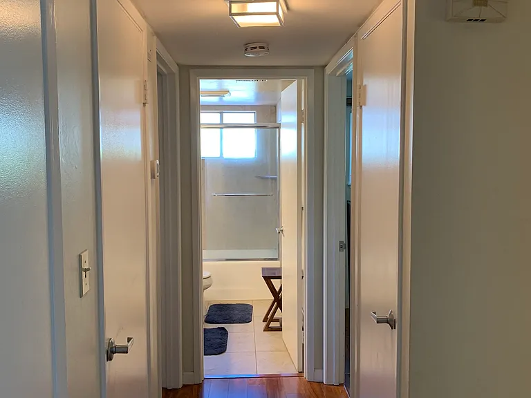 hallway to bedroom and bath