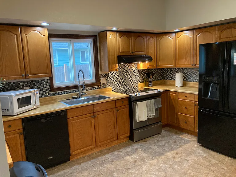Kitchen, freshly painted, high ceilings.