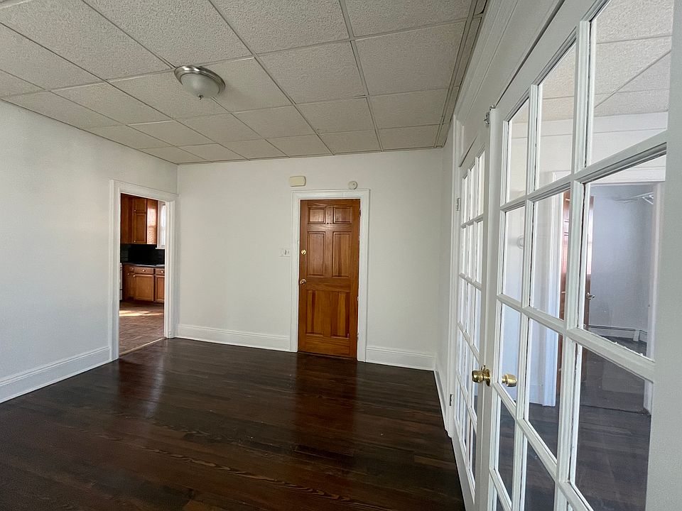 Alternative View of Living room with view of the kitchen and bedroom on the right