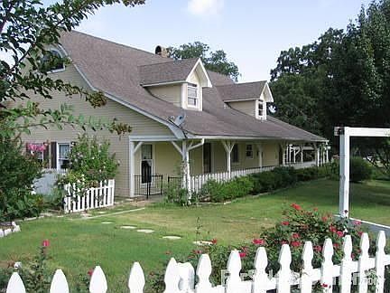 View of the back porch
						:
						Large porch on both the west and east side of the house.