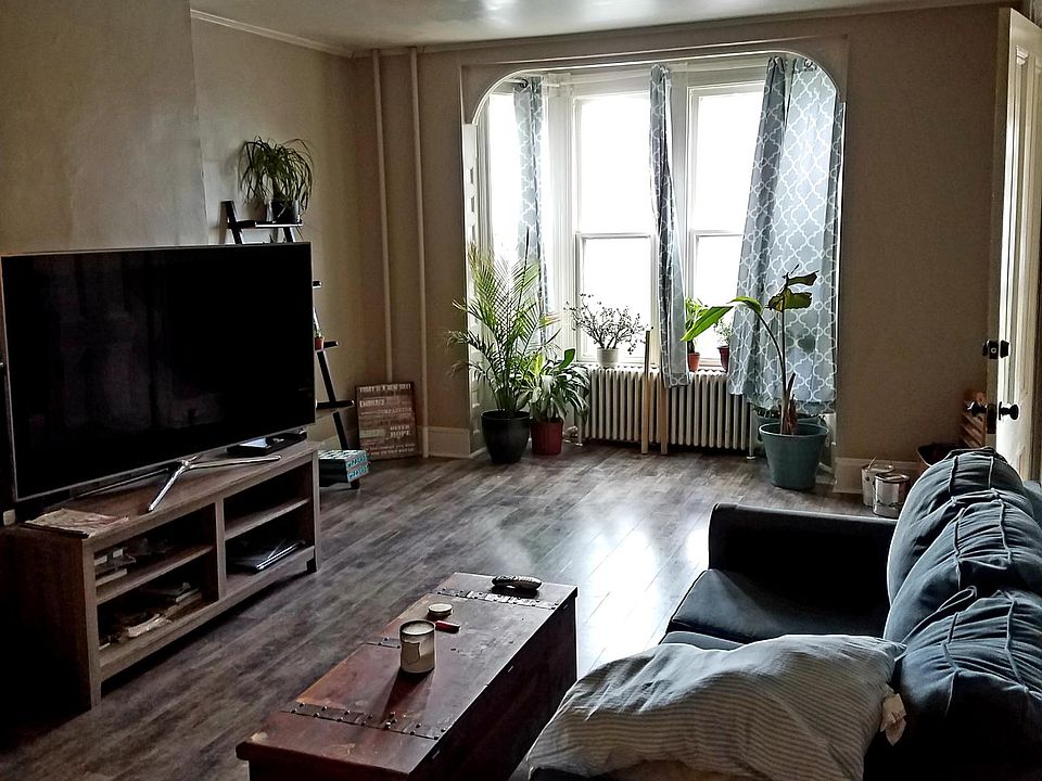 Spacious and open living room with new floors throughout