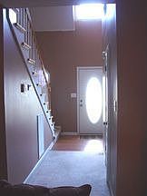 Front entrance with 1/2 bath on right.  