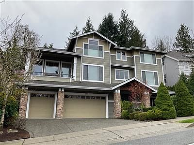 Front of home with 3-car garage.