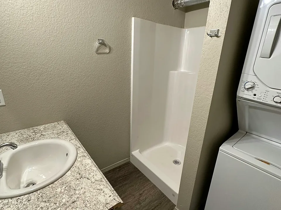 Bathroom with washer and dryer