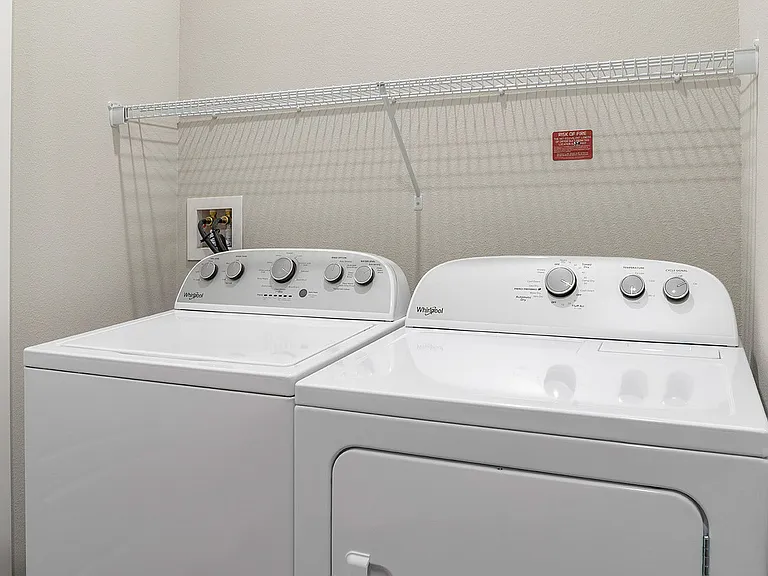 Experience convenience with this stylish and efficient laundry space, perfect for any home.