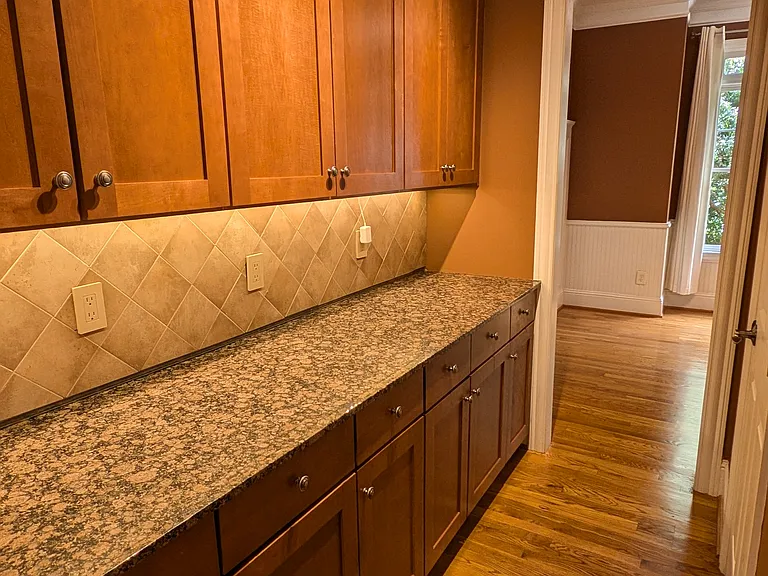 Butler's pantry off the kitchen and dining room provides ample cabinets AND a full pantry closet!