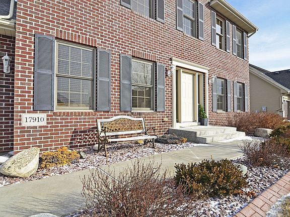 Classic two-story, brick front styling, on a lovely corner lot. 