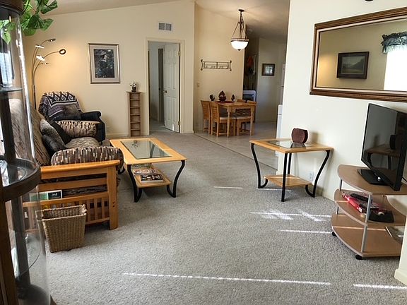 living room has futon and 40" TV. Home is fully furnished