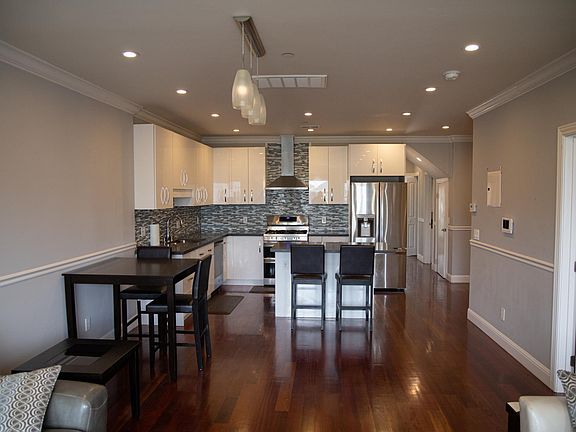 View of kitchen from living room area (3rd floor). The front bedroom is to the right.