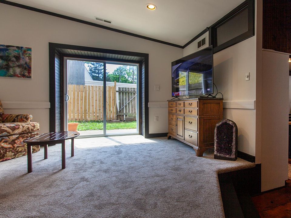 living room with sliding door to backyard