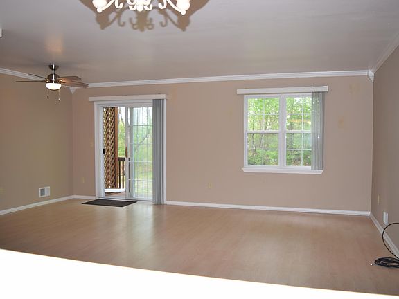 Spacious living area with cable hook-up and storage utility 