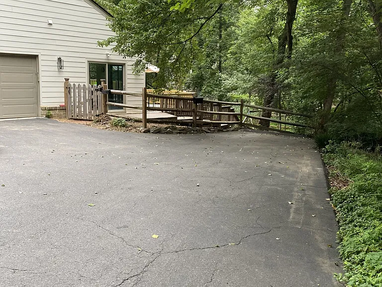 Parking is straight ahead and the backyard gate is to the left.