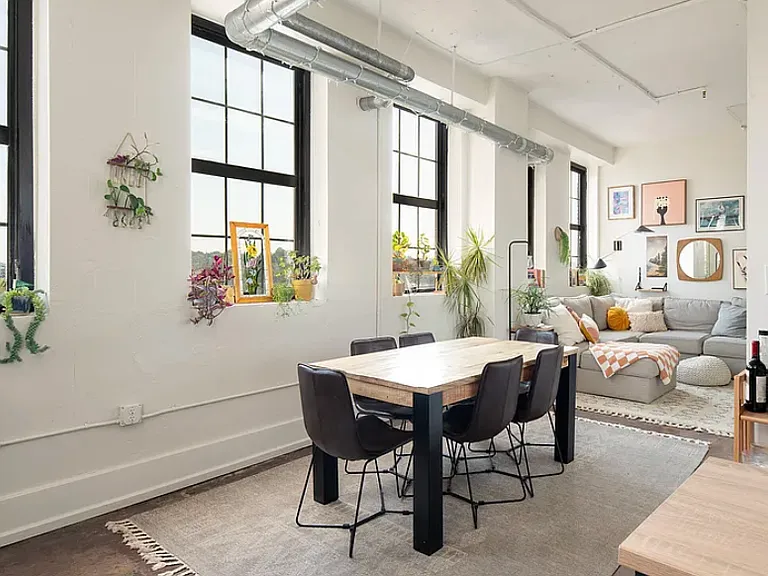 Soaring ceilings and oversized industrial windows _ natural light all day