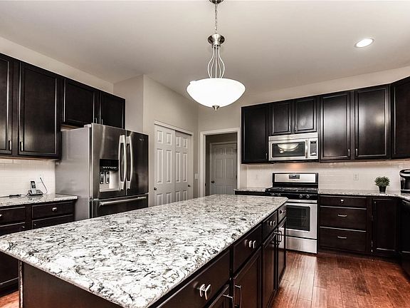New Cambria tops, subway tiled backsplash and SS appliances.