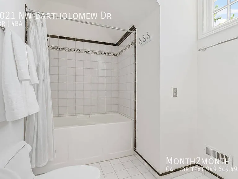 9021 NW Bartholomew Dr — Photo 30