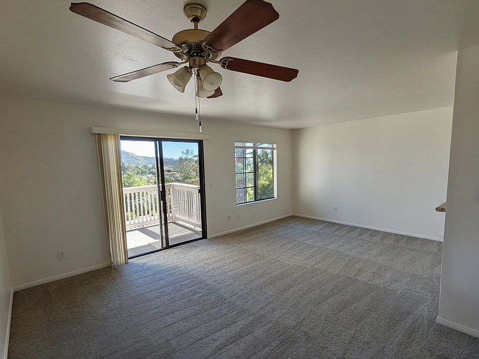 Spacious, open-concept living area with brand-new, high-quality carpet and fresh custom paint (Completed Feb 2026).