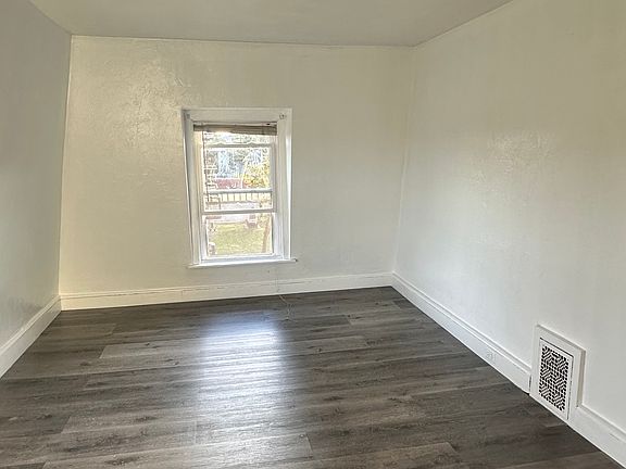 freshly painted up-stair bedroom with brand new LVP floor
