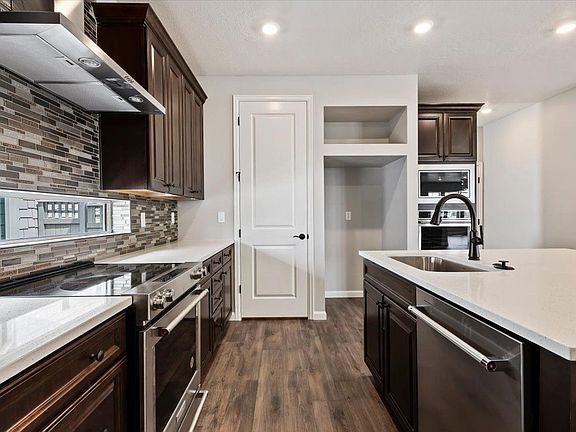 A view of the kitchen, pantry and island